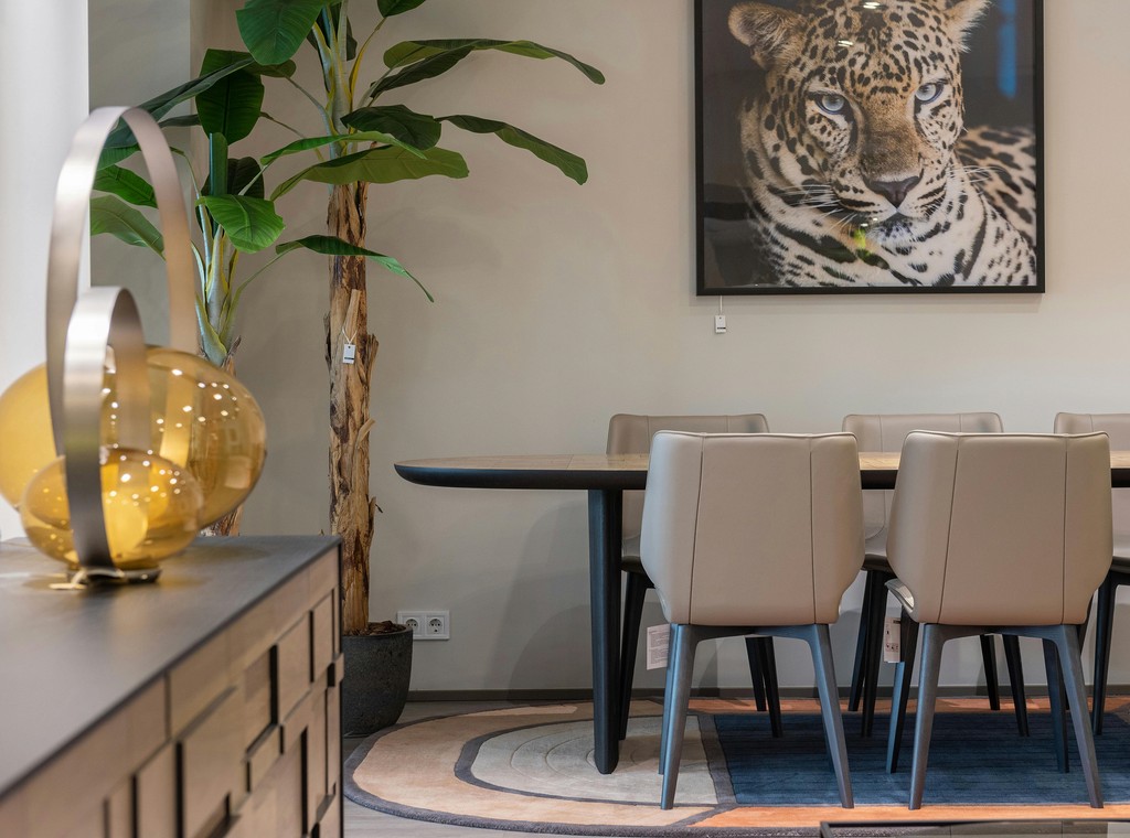 Dining table with leopard wall art