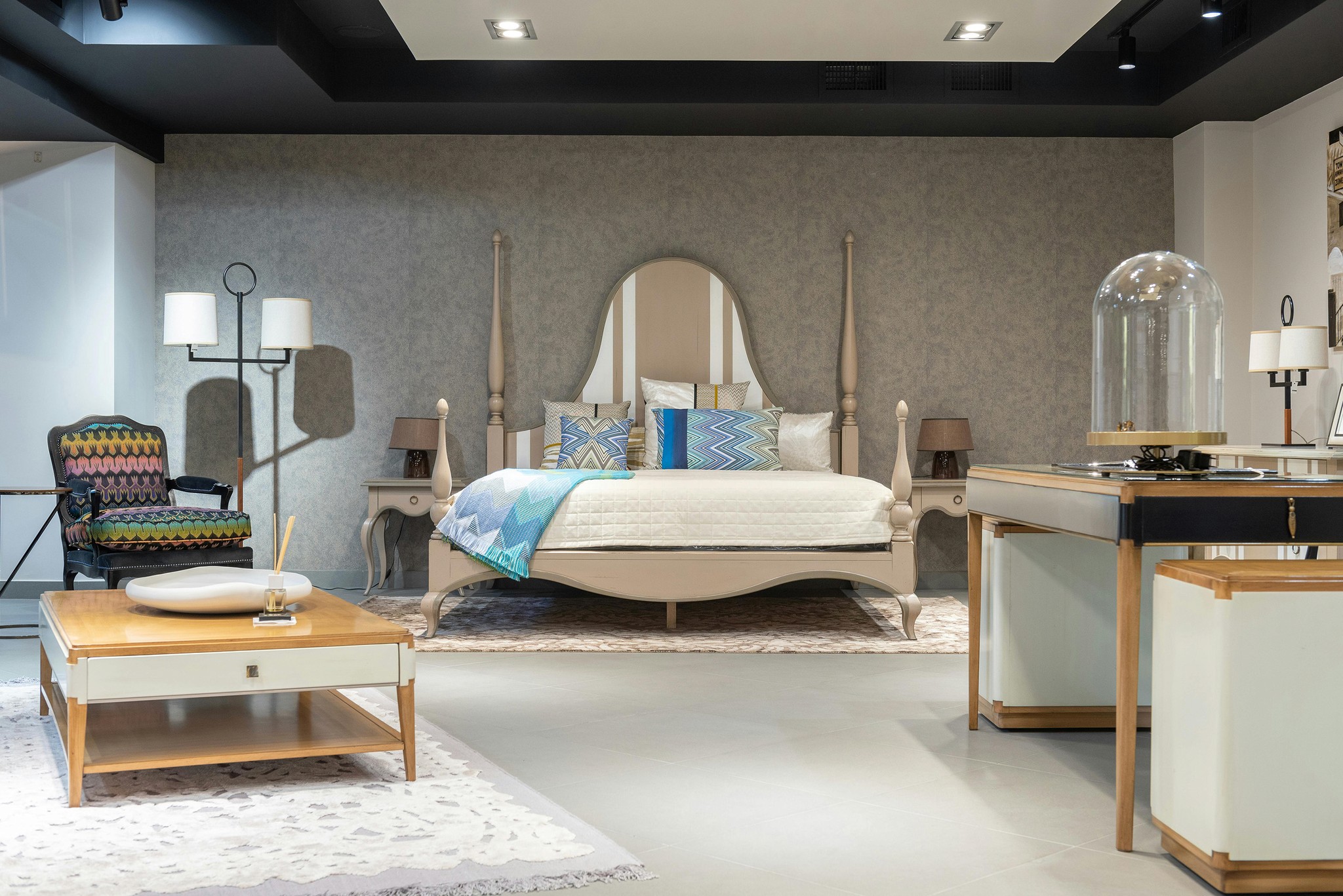 Classic bedroom with canopy bed and patterned pillows
