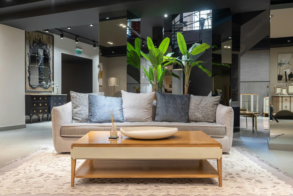 Neutral sofa with cushions and wooden coffee table